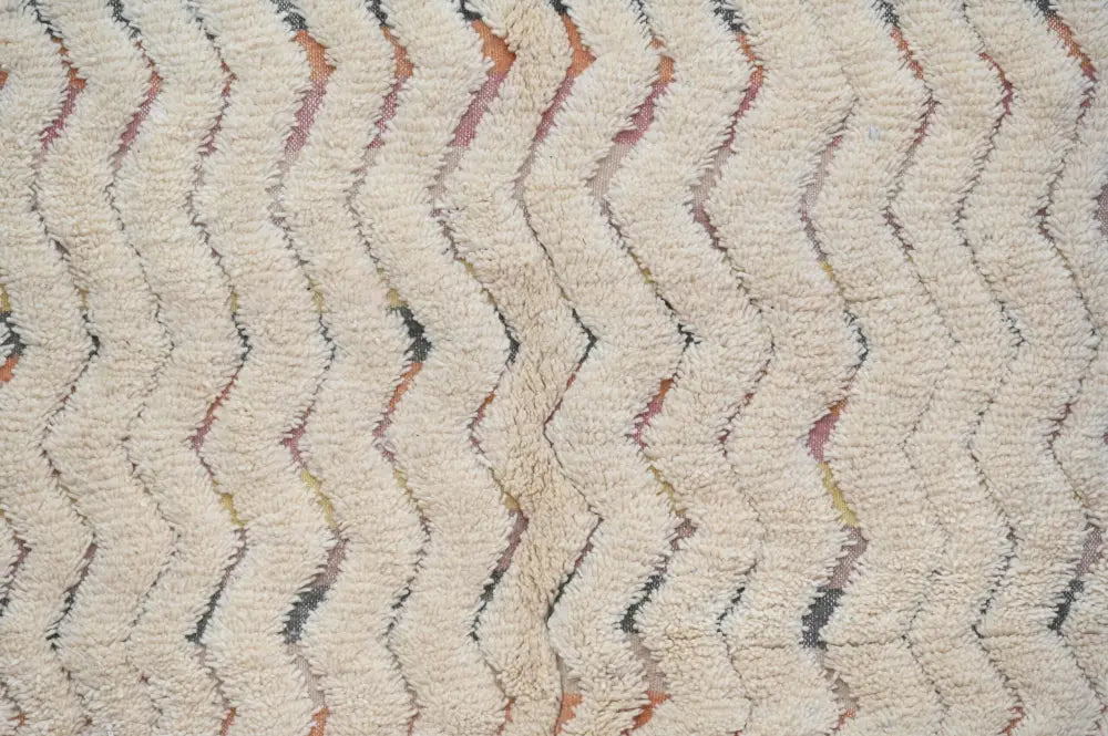 Cream-colored plush shag rug with zigzag pattern in rust and gray handcrafted as decorbites™ handmade traditional azilal rug