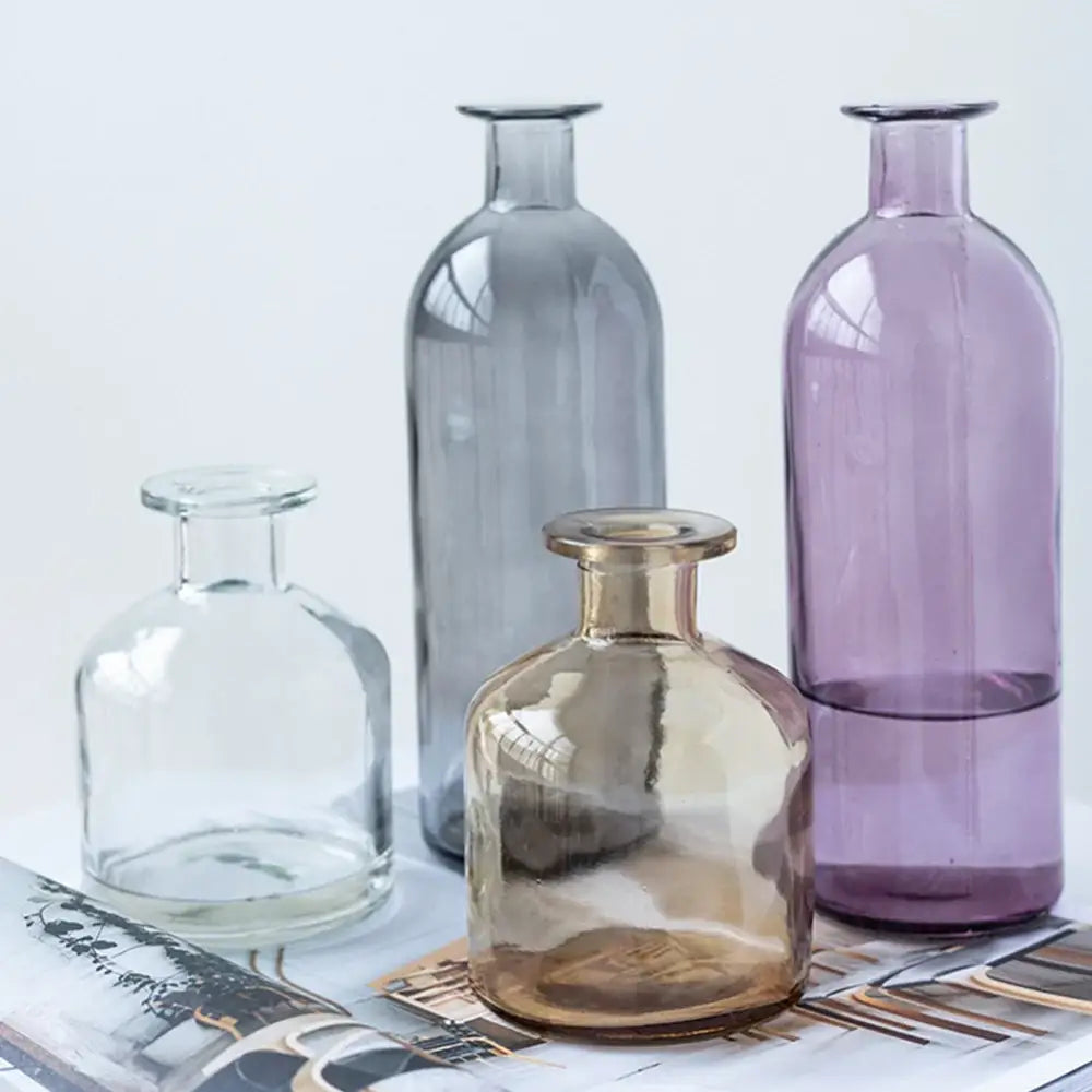 Set of four DecorBites™ glass vases in clear gray amber and purple with 2cm opening for flower pot use