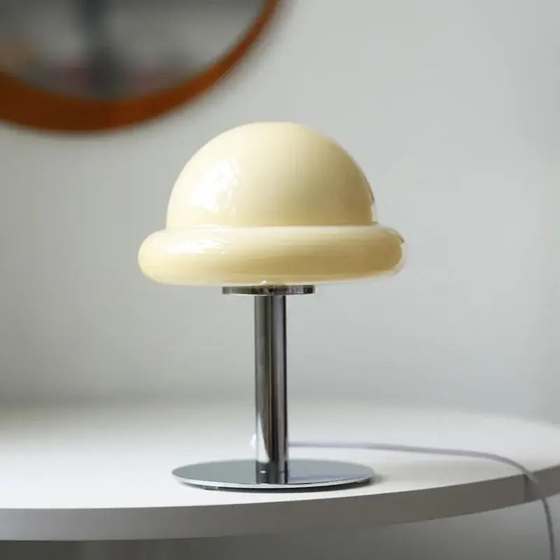 Cream-colored glossy acrylic mushroom table lamp with sleek chrome stem and base for modern decorbites table lamp