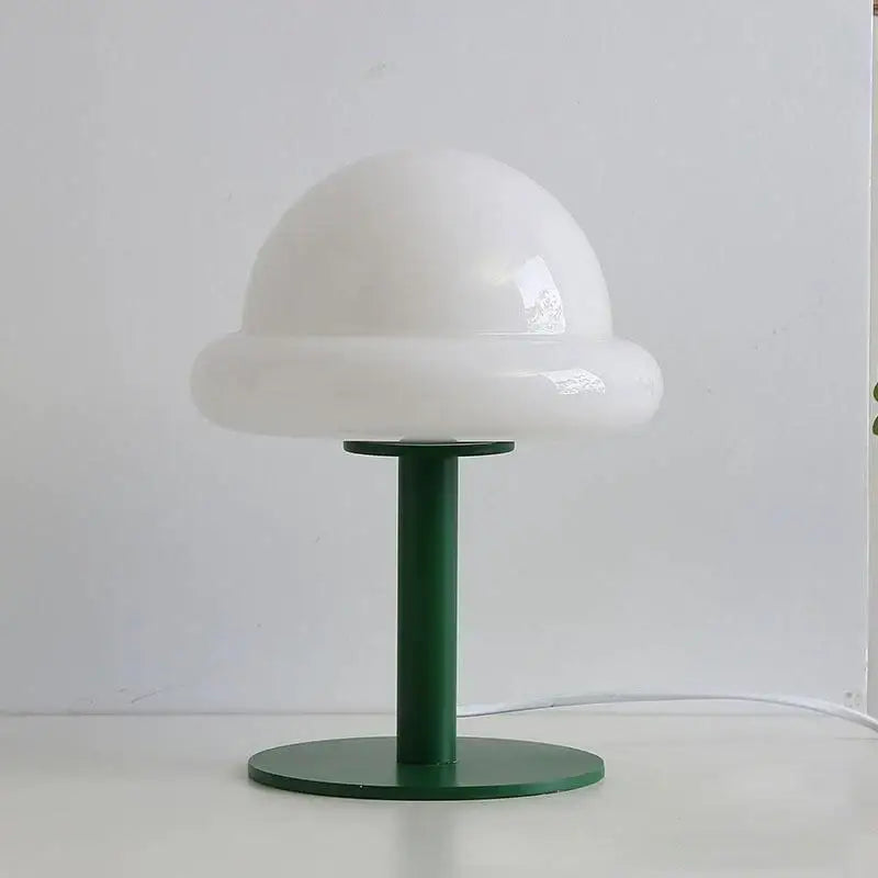 Decorbites™ mushroom table lamp with a glossy white mushroom-shaped shade on a dark green metal base in bauhaus style