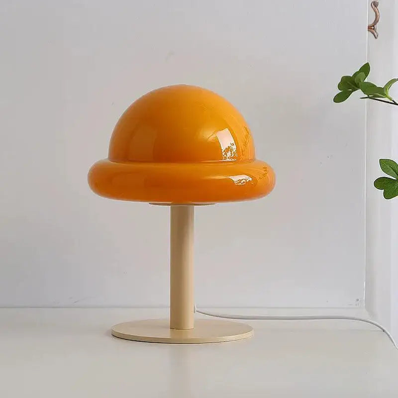 DecorBites™ mushroom table lamp with vibrant orange glossy acrylic dome on a slender wooden stand in Bauhaus style