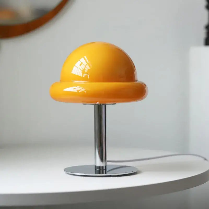 DecorBites™ mushroom table lamp with vibrant orange glossy acrylic dome and chrome base in bauhaus style furniture design