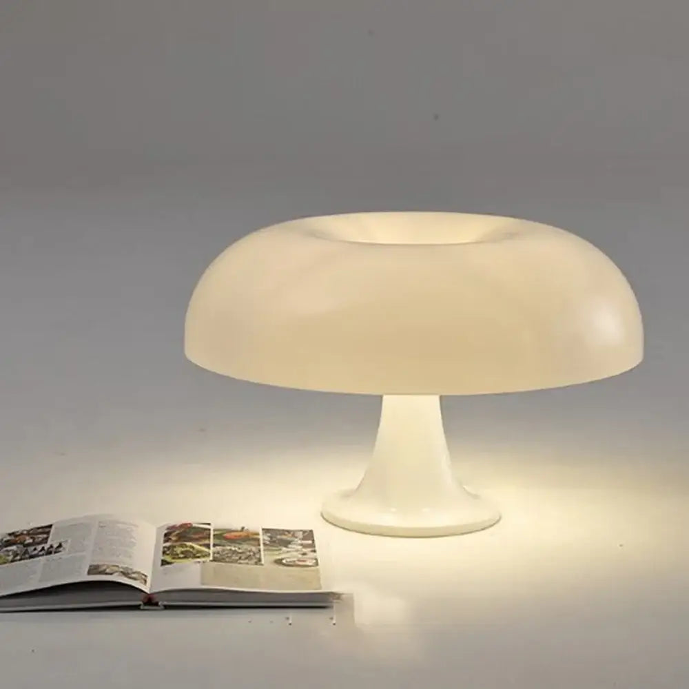 Cream-colored cream-colored mushroom table lamp with smooth translucent plastic body and usb plug for bedside use