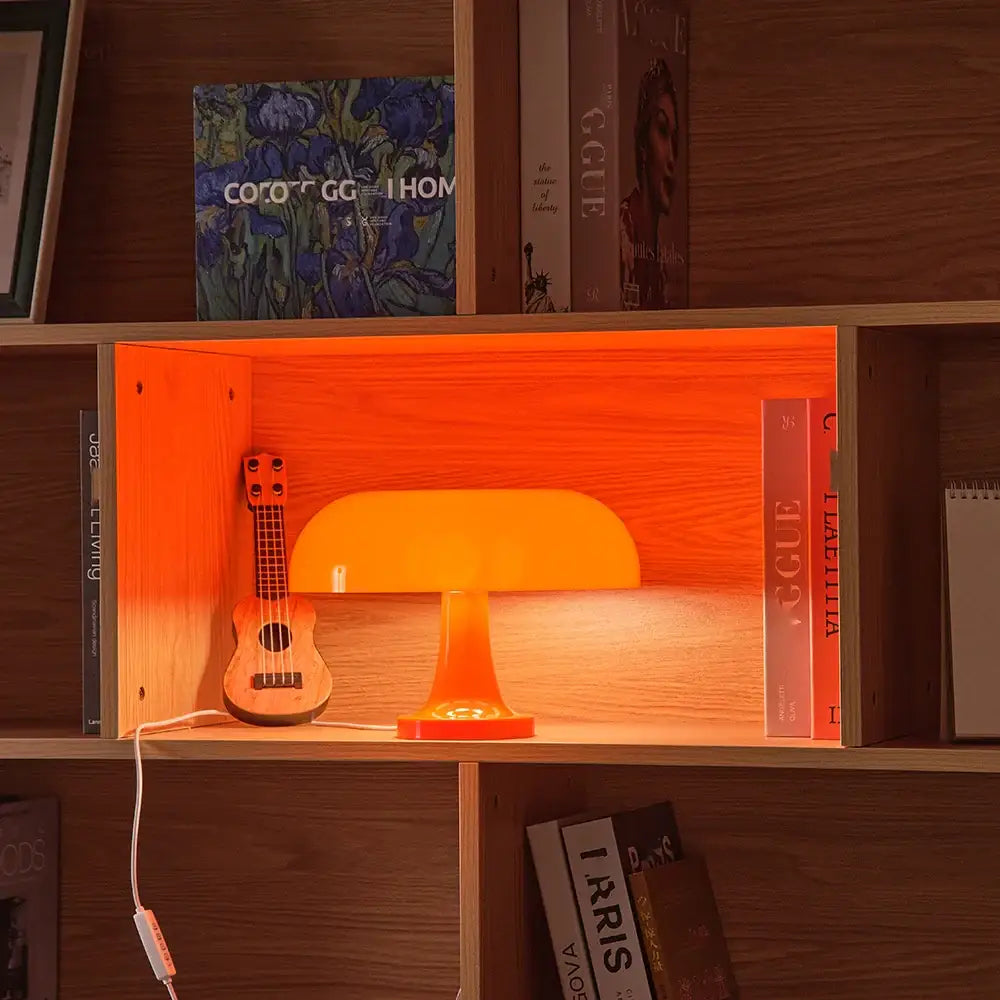 Orange acrylic mushroom table lamp with a curved dome shade and matching base usb plug for bedside use