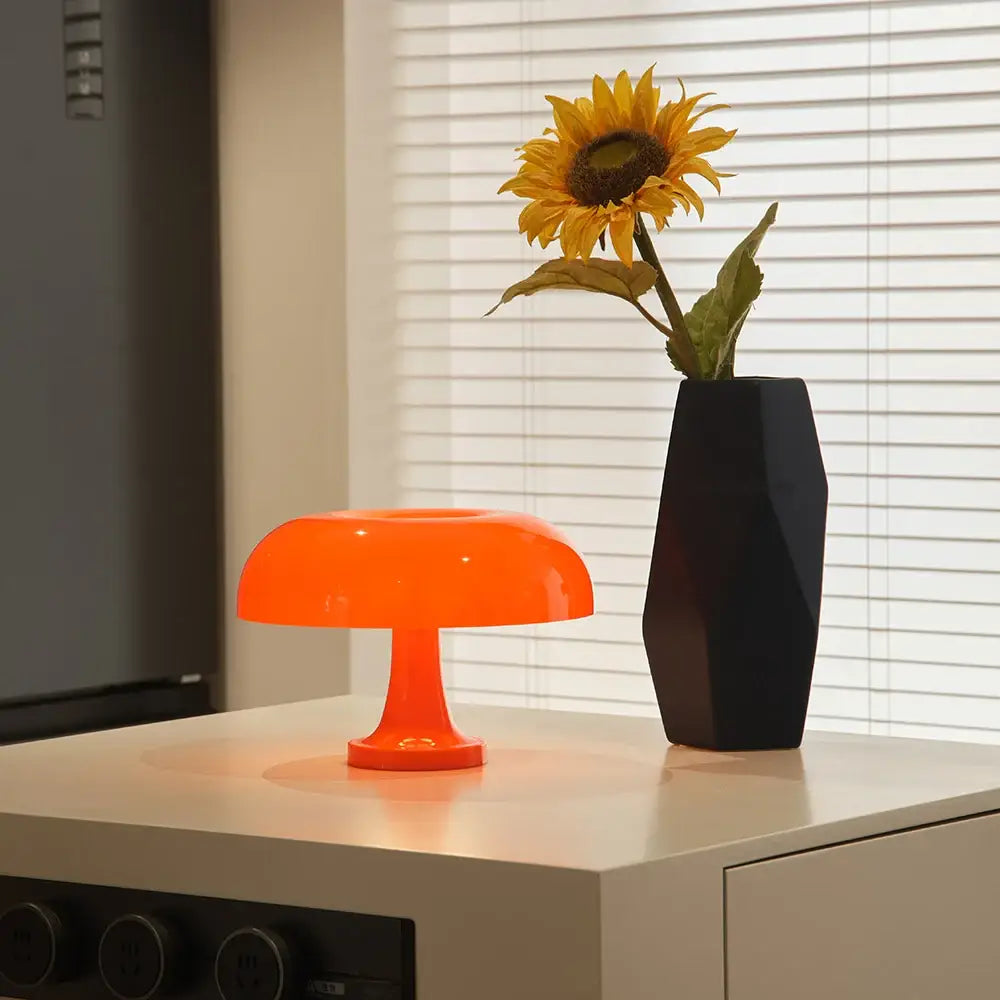 Vibrant orange mushroom table lamp with usb plug designed for minimalist modern bedrooms by DecorBites