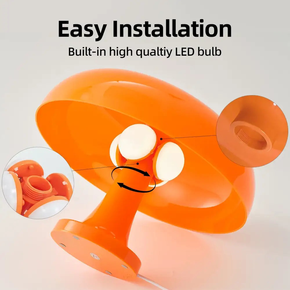 Bright orange glossy plastic mushroom table lamp with built-in led bulb suction cup base and usb plug for bedside use