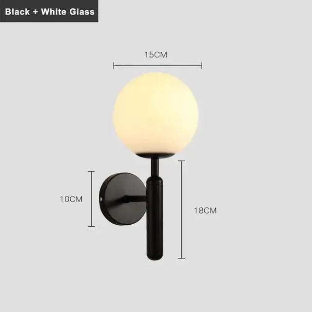 Black DecorBites™ Mynte wall sconce with frosted white spherical glass shade for luxury wall lighting