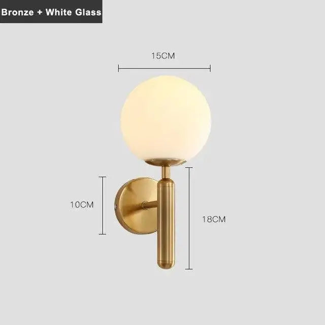 Bronze-finished decorbites mynte wall sconce with frosted white glass globe for luxury indoor lighting