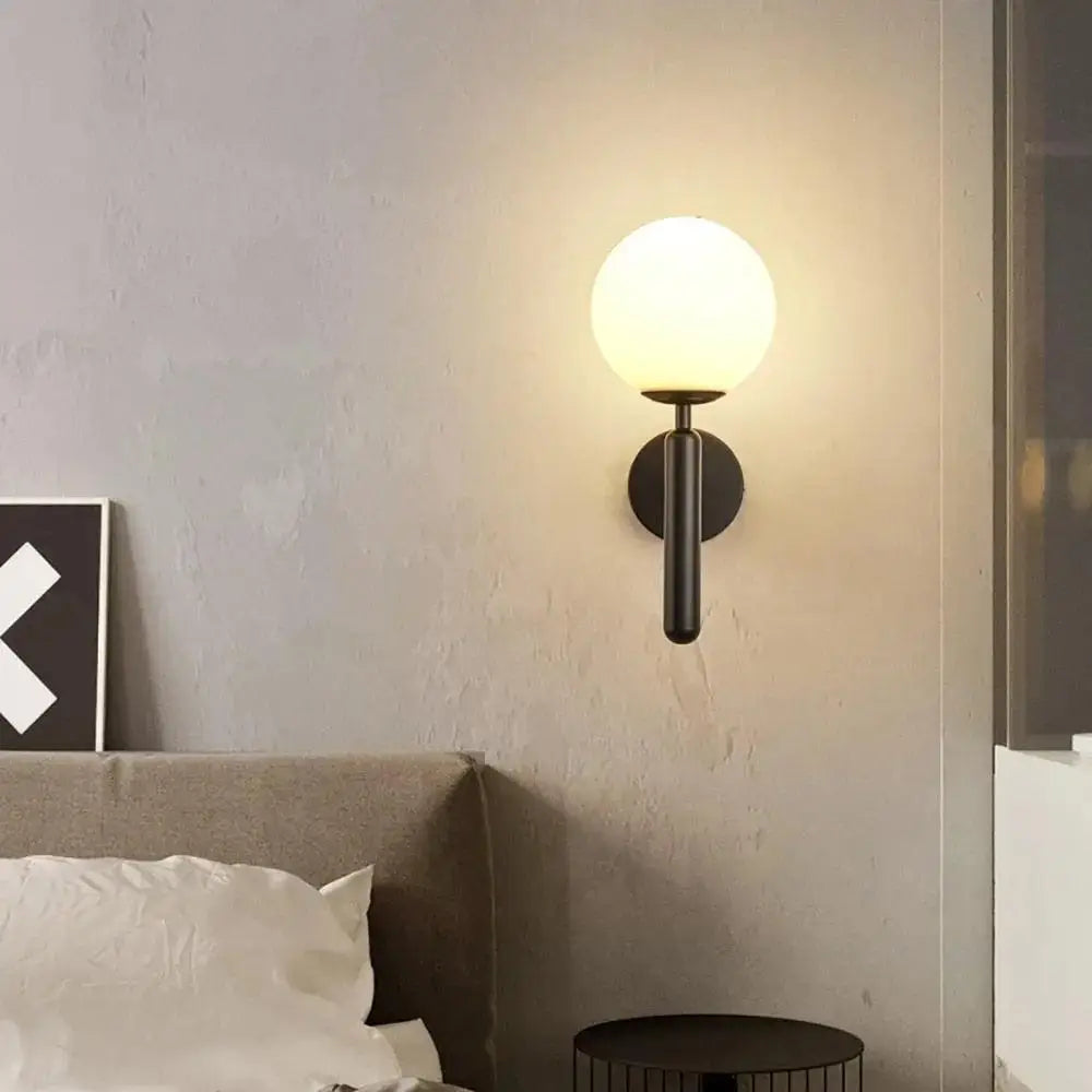 Modern black mynte wall sconce with frosted glass globe shade by DecorBites™ for luxury interior lighting