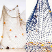 Beige and navy blue fishing net decoration with dried seashells and wooden beads for nautical theme wall decor