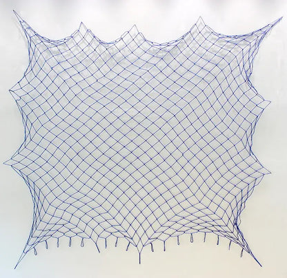 DecorBites™ nautical theme wall decor featuring a blue diamond-patterned fishing net decoration with tassels and scalloped edge