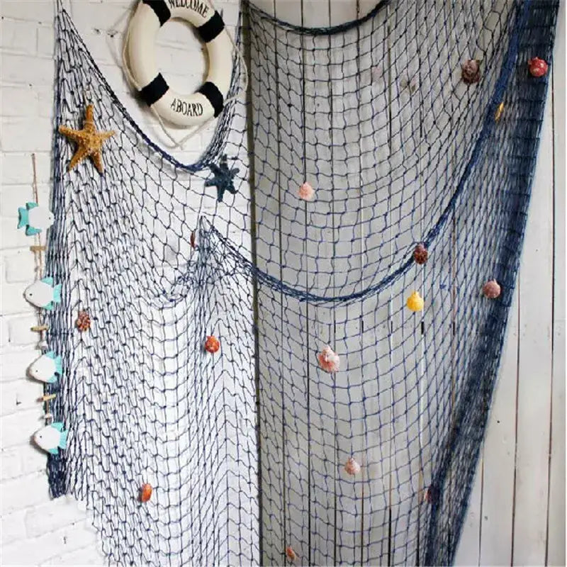 Decorbites™ nautical theme wall decor featuring a blue fishing net decoration with colorful seashells and starfish accents