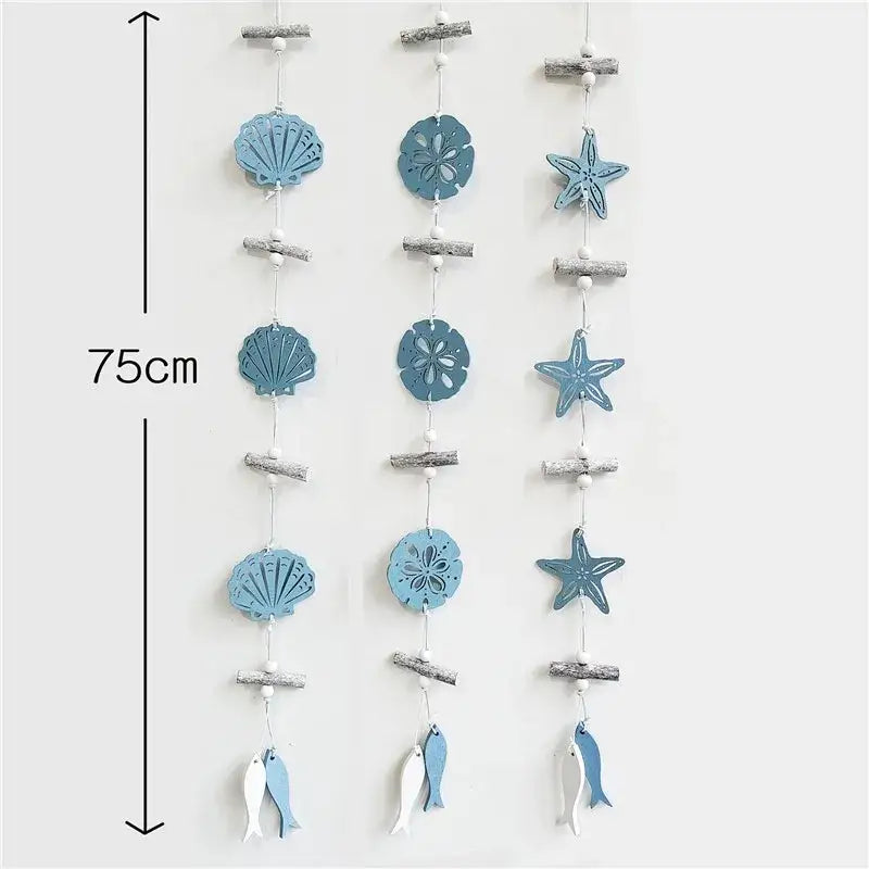 Decorbites™ nautical theme wall decor with blue wooden strands featuring shells, starfish, sand dollars, and fishing net decoration