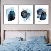 DecorBites™ navy blue geometric wall art set featuring three framed abstract pieces with layered shapes and gold leaf accents