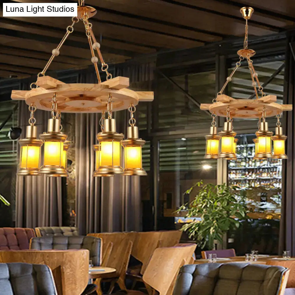 Rustic wooden ship wheel industrial pendant chandelier with six brass lanterns and chains by DecorBites Noemi