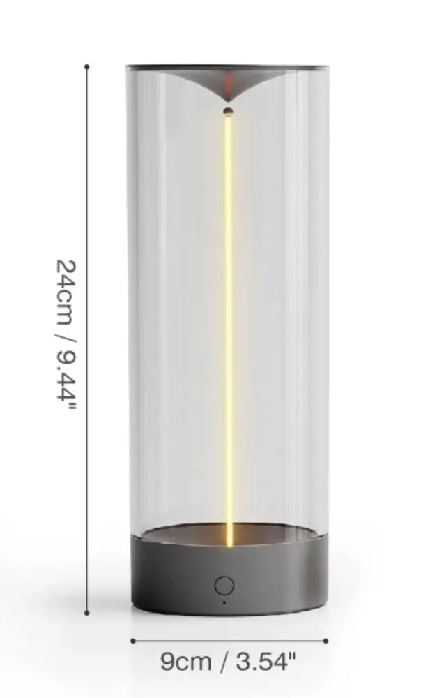 DecorBites™ nordic battery operated table lamp with a sleek transparent cylindrical design and glowing yellow light