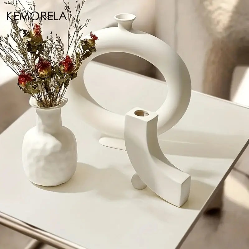 White ceramic nordic ceramic vase with textured rounded body and narrow neck holding dried flowers decorbites home decor accent