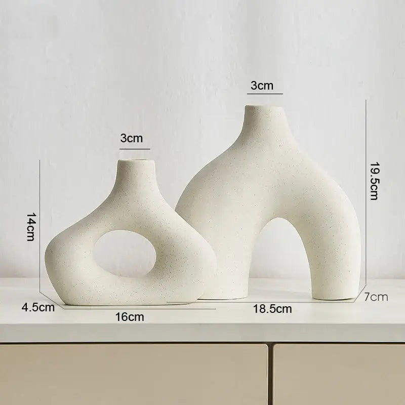 Cream-colored nordic ceramic vases home decor with organic sculptural forms and a matte finish by decorbites™