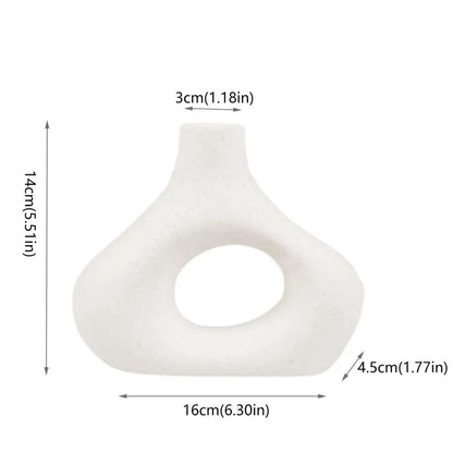 White ceramic nordic ceramic flower vase with matte finish and asymmetrical oval opening for vases home decor