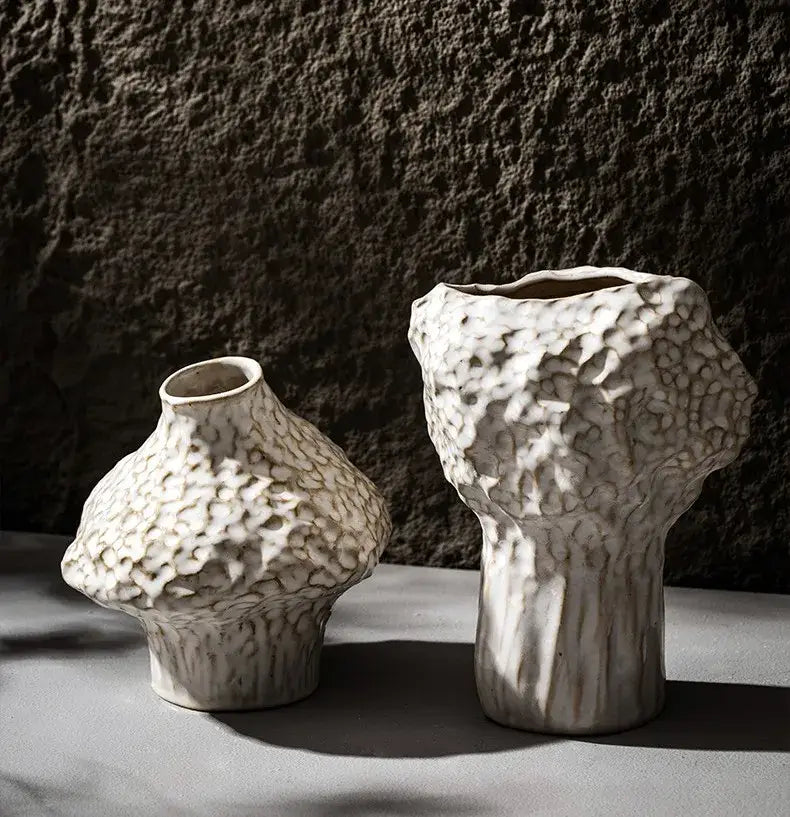 Two white ceramic vases with textured organic surface and irregular shapes nordic ceramic vase by decorbites