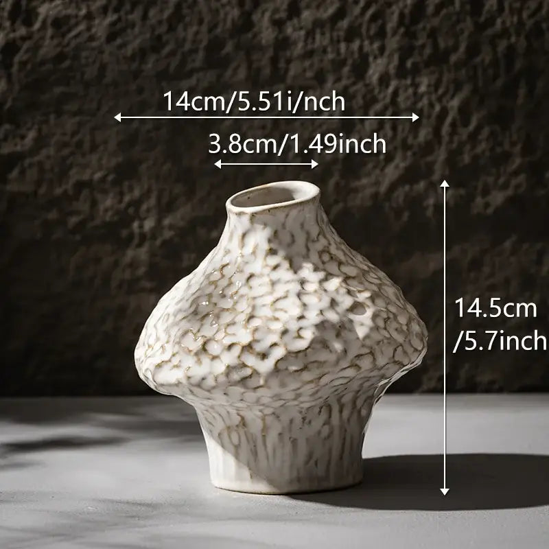 Decorbites™ nordic ceramic vase in white with a textured pebbled surface and organic asymmetrical shape with pampas grass