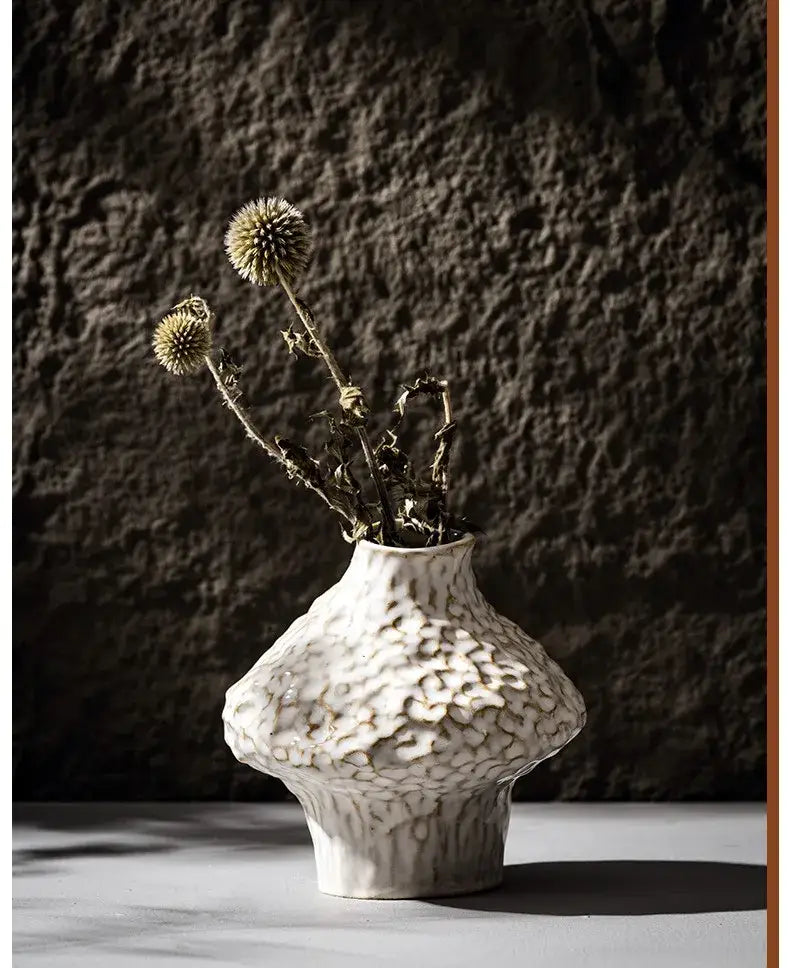 White textured nordic ceramic vase by decorbites holding dried thistle flowers for stylish home decor