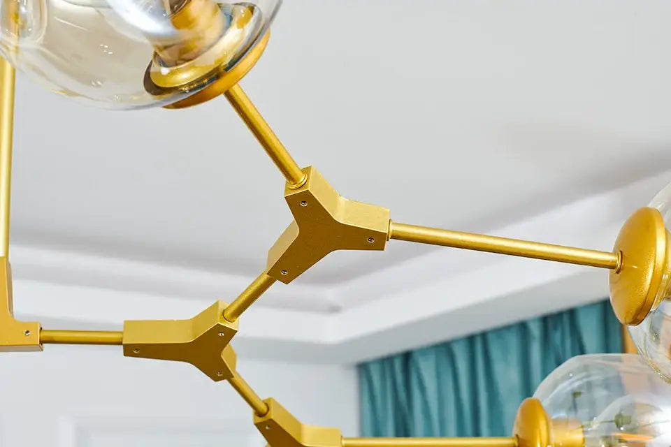 Gold-toned metal nordic chandelier with clear glass globe shades hanging light fixture for living room decor