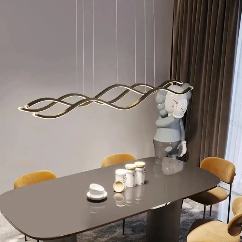 Modern gold-toned wave-shaped LED pendant light with sleek curves for stylish dining room nordic chandeliers decor