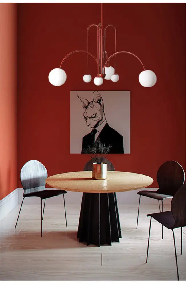 A modern copper-toned comet chandelier nordic with multiple curved arms and white glass ball lights for elegant decor