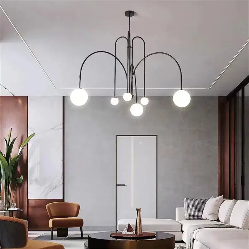 Black metal comet chandelier nordic with multiple spherical glass bulbs for elegant home décor by DecorBites