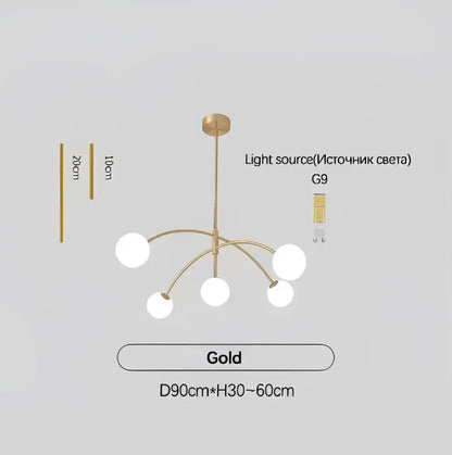 Gold-colored DecorBites™ Nordic comet chandelier with five white glass ball shades and central brass fixture for elegant home décor