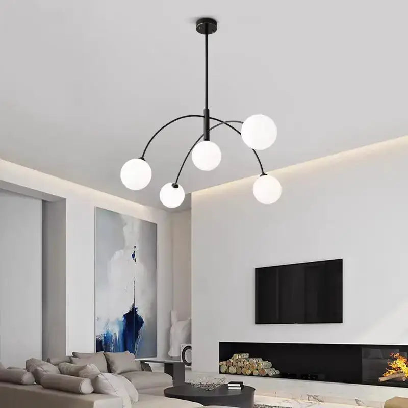 Modern black metal comet chandelier nordic with five frosted glass globe lights for elegant home décor by DecorBites™