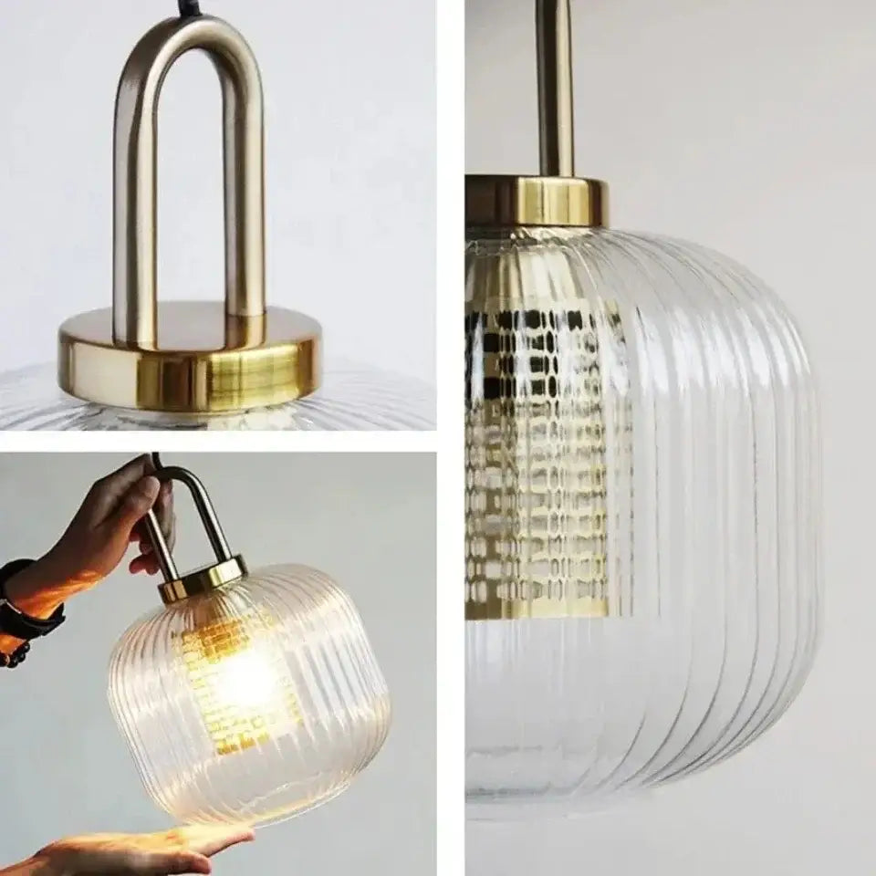 A modern deer head wall lamp with clear ribbed glass shade and brass-finished metal hardware by decorbites