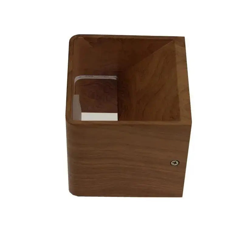 A sleek square-shaped wooden tissue box with smooth finish and visible grain complements nordic faux wooden wall decor