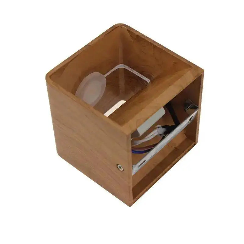 A decorbites™ nordic faux wooden wall light with clear acrylic insert and wiring in natural wood grain finish