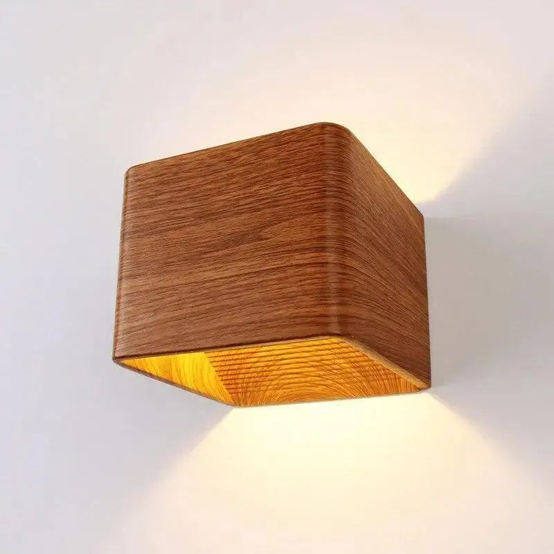 DecorBites™ nordic faux wooden cube wall sconce with warm finish and softly glowing interior light for bedroom