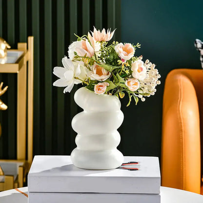 White ceramic nordic flower vase with wavy segmented design for modern home decor by DecorBites