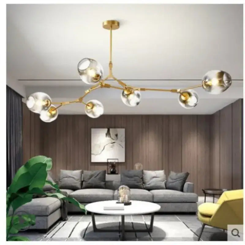 Gold-toned nordic glass ball led chandelier featuring clear glass globe bulbs in black and gold finish