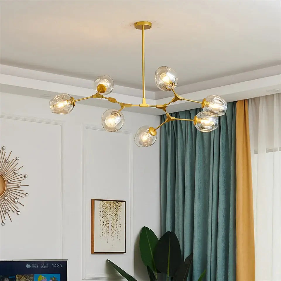 Gold-toned decorbites™ nordic glass ball led chandelier with clear glass globe bulbs and black gold branching frame