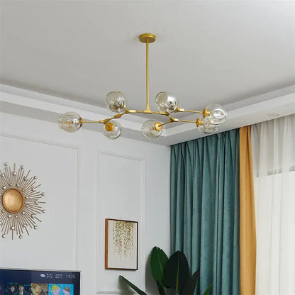 Gold-toned nordic glass ball led chandelier with six clear glass globe bulbs in black and gold finish