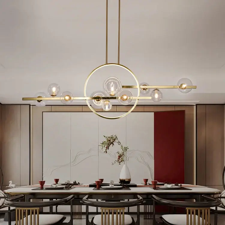 Gold-toned nordic glass bubble led chandelier with clear glass spheres and circular frame by DecorBites in black