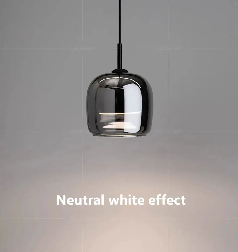 A sleek nordic glass led pendant chandelier with a glossy black glass shade and thin black cord by DecorBites™
