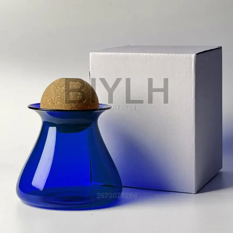 A cobalt blue glass vase with a rounded cork stopper for home decor by DecorBites nordic glass vase small size