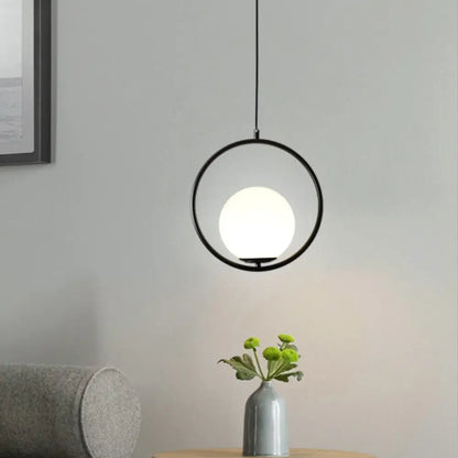 DecorBites™ nordic gold pendant light featuring a black circular pendant light with frosted white glass shade bulb