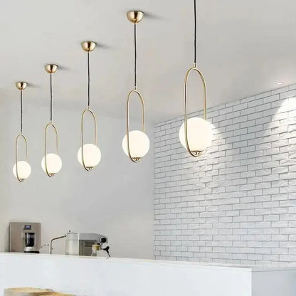 Decorbites nordic gold pendant light featuring modern brass oval frames with frosted glass shade globes