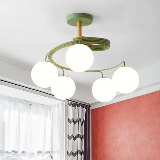 DecorBites Nordic iron swirl flush chandelier with five orb glass shades on green metal frame and wooden downrod