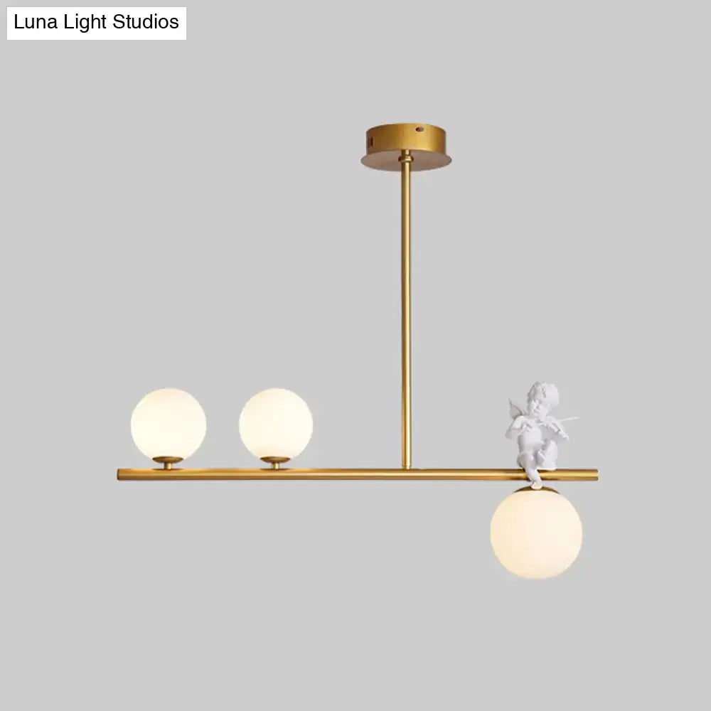 Decorbites™ nordic island angel pendant light with gold-toned metal, opaline glass shade, and white cherub figurine