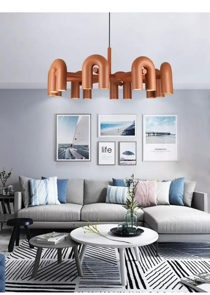 Copper-toned decorbites™ nordic led ceiling chandelier with curved pipe-like arms and central hanging rod for home decor