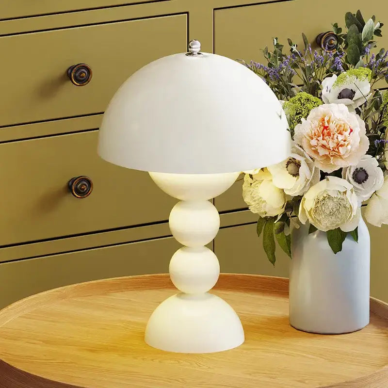 A sleek white ceramic table lamp with a dome shade and stacked base featuring nordic led usb dimmable lighting