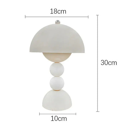 A modern white ceramic table lamp with dome shade and stacked spheres featuring usb dimmable nordic led lighting